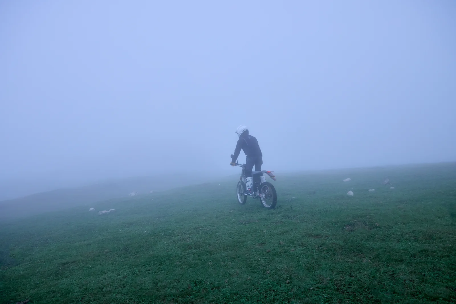 A distant rider in the mist.